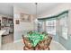 Cozy breakfast nook with bright windows and plenty of natural light at 3923 Manor Oaks Ct, Leesburg, FL 34748