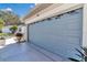 Gray garage door with decorative windows at 3923 Manor Oaks Ct, Leesburg, FL 34748