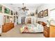 Bright main bedroom featuring a vaulted ceiling, ceiling fan, and ample space at 3923 Manor Oaks Ct, Leesburg, FL 34748