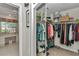 Large walk-in closet with ample hanging space and shelving at 3923 Manor Oaks Ct, Leesburg, FL 34748