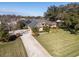 Aerial view of a house with a driveway and landscaping at 4048 Se 38Th Loop, Ocala, FL 34480