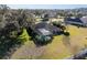 Aerial view of house with pool and screened enclosure, showcasing large backyard and neighborhood setting at 4048 Se 38Th Loop, Ocala, FL 34480