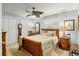 Comfortable bedroom with ceiling fan, built-in shelving and large windows at 4048 Se 38Th Loop, Ocala, FL 34480