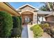 Front entry with stone accents and lush landscaping at 4048 Se 38Th Loop, Ocala, FL 34480