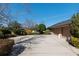 Three-car garage with a large concrete driveway at 4048 Se 38Th Loop, Ocala, FL 34480