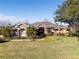 Two story home with a large front yard and landscaping at 4048 Se 38Th Loop, Ocala, FL 34480