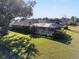 Relaxing pool area with a screened enclosure and grassy lawn at 4048 Se 38Th Loop, Ocala, FL 34480