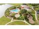 Community pool and playground surrounded by lush landscaping at 5409 Sw 42Nd Pl, Ocala, FL 34474