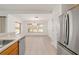 Kitchen and dining area with tile floors and a chandelier at 5409 Sw 42Nd Pl, Ocala, FL 34474