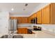 Kitchen with stainless steel appliances and wood cabinets at 5409 Sw 42Nd Pl, Ocala, FL 34474