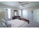 Serene bedroom with a wooden bed frame, dresser, and decorative pillows at 5429 Sw 44Th Court Rd, Ocala, FL 34474