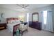 Relaxing main bedroom with an elegant ceiling fan, large windows and neutral color palette at 5429 Sw 44Th Court Rd, Ocala, FL 34474