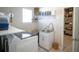 Bright laundry room with a sink, washer, and dryer at 5429 Sw 44Th Court Rd, Ocala, FL 34474