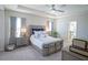 Bright main bedroom with ceiling fan and attached bath at 5429 Sw 44Th Court Rd, Ocala, FL 34474