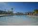 Community pool with palm trees and lounge chairs at 5429 Sw 44Th Court Rd, Ocala, FL 34474