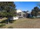 Home with screened patio and grassy backyard at 6760 Sw 112Th St, Ocala, FL 34476