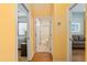 Bright hallway with wood floors, leading to bedroom and bathroom at 6760 Sw 112Th St, Ocala, FL 34476