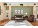 Living area with brown leather furniture and a neutral color palette at 6760 Sw 112Th St, Ocala, FL 34476