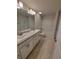 A bathroom offers a dual sink granite vanity, with a private toilet and shower/tub combo at 6915 Sw 152Nd St, Ocala, FL 34473