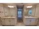 The bathroom offers dual vanities, each featuring granite countertops and undermount sinks at 6915 Sw 152Nd St, Ocala, FL 34473