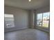 Bright bedroom with tile flooring, large windows, and neutral wall colors at 6915 Sw 152Nd St, Ocala, FL 34473