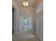 Welcoming entryway with light tile floors leading to a bright living area at 6915 Sw 152Nd St, Ocala, FL 34473