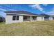 Single story home with covered patio and grassy backyard at 6915 Sw 152Nd St, Ocala, FL 34473