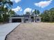 Charming single-story home with a modern design, two-car garage, and inviting front entrance at 6915 Sw 152Nd St, Ocala, FL 34473