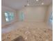 Bright and open living space with large windows and tiled flooring at 6915 Sw 152Nd St, Ocala, FL 34473