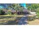 Single story home with a long driveway and large yard at 700 Se 49Th Ave, Ocala, FL 34471