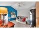 Bedroom featuring a daybed, blue walls, and a ceiling fan at 700 Se 49Th Ave, Ocala, FL 34471