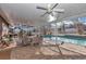 Enjoy this relaxing pool area, complete with a screened enclosure and patio furniture at 700 Se 49Th Ave, Ocala, FL 34471