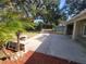 Large backyard with a patio and landscaping at 7375 Sw 106Th St, Ocala, FL 34476