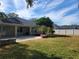 Large backyard with home, grassy area, and trees at 7375 Sw 106Th St, Ocala, FL 34476