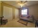 Bright bedroom featuring a comfortable sofa bed and lots of closet space at 7375 Sw 106Th St, Ocala, FL 34476