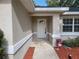 Inviting front entrance with white door and red mulch at 7375 Sw 106Th St, Ocala, FL 34476