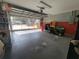 Attached garage with storage and lawn equipment at 7375 Sw 106Th St, Ocala, FL 34476