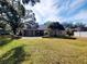 Single-story home with covered patio and large backyard at 7375 Sw 106Th St, Ocala, FL 34476