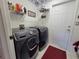 Laundry room with Samsung washer and dryer and additional storage at 7375 Sw 106Th St, Ocala, FL 34476