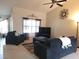 Spacious living room with comfy seating and large TV at 7375 Sw 106Th St, Ocala, FL 34476