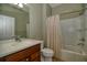 Bathroom featuring a shower and tub, neutral colored walls, tile flooring and a single sink at 7387 Sw 99Th Ct, Ocala, FL 34481