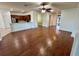 Spacious living room featuring hardwood floors and open concept layout at 7387 Sw 99Th Ct, Ocala, FL 34481