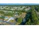 Sprawling community featuring mature trees and well-maintained homes under a bright blue sky at 7556 Sw 112Th Ln, Ocala, FL 34476