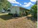 Home exterior with an air conditioning unit in the backyard at 7556 Sw 112Th Ln, Ocala, FL 34476