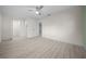 Large bedroom with ceiling fan and wood-look floors at 7556 Sw 112Th Ln, Ocala, FL 34476