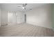 Spacious bedroom with wood-look floors and multiple closets at 7556 Sw 112Th Ln, Ocala, FL 34476