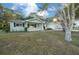 Ranch style home with a front porch and large yard at 7556 Sw 112Th Ln, Ocala, FL 34476