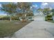 Attractive single-story home boasting a well-kept lawn and a spacious driveway leading to a two-car garage at 7556 Sw 112Th Ln, Ocala, FL 34476