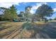 Inviting single-story house showcasing a well-manicured lawn and verdant landscaping at 7556 Sw 112Th Ln, Ocala, FL 34476