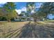 Charming single-story home with mature trees and a well-manicured lawn at 7556 Sw 112Th Ln, Ocala, FL 34476